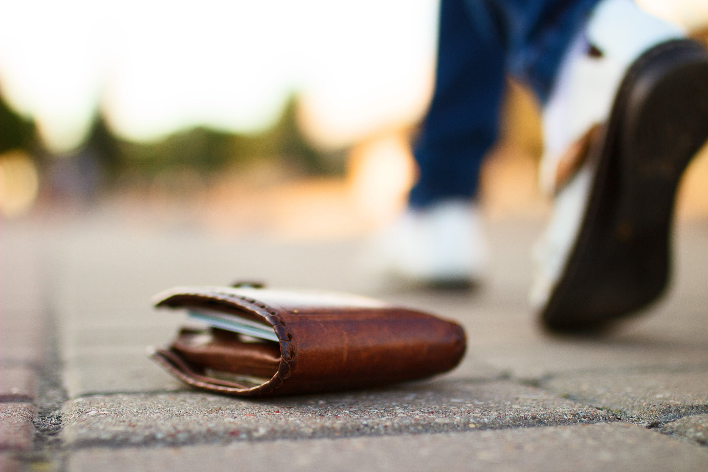 Lost wallet, laying on cobblestone street