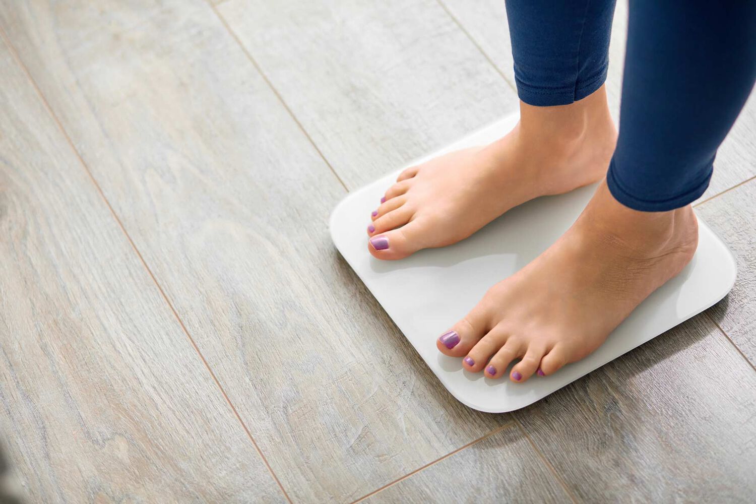 standing on a scale